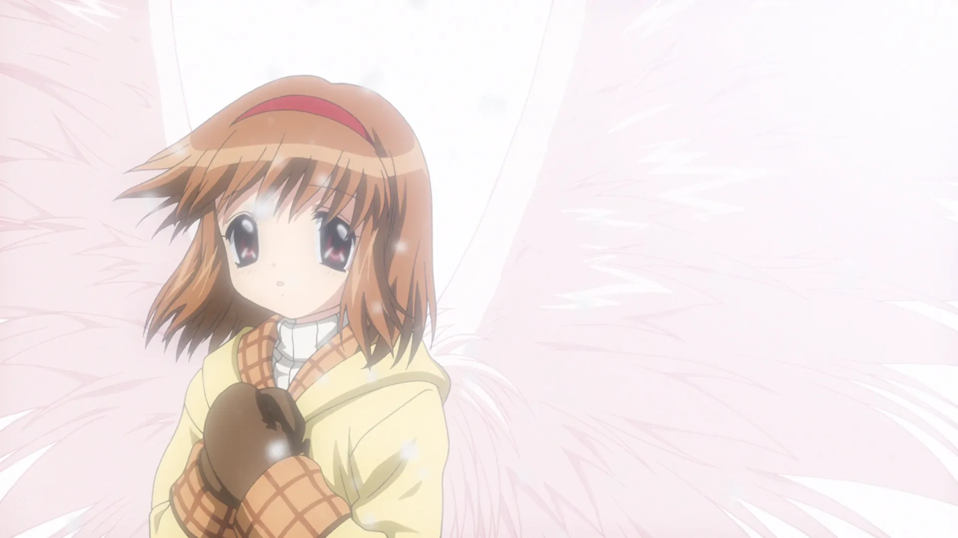 A still frame from the opening sequence of Kanon. It shows the main heroine, Tsukimiya Ayu, with her hands held to her chest, and angelic wings sprouting from her back.